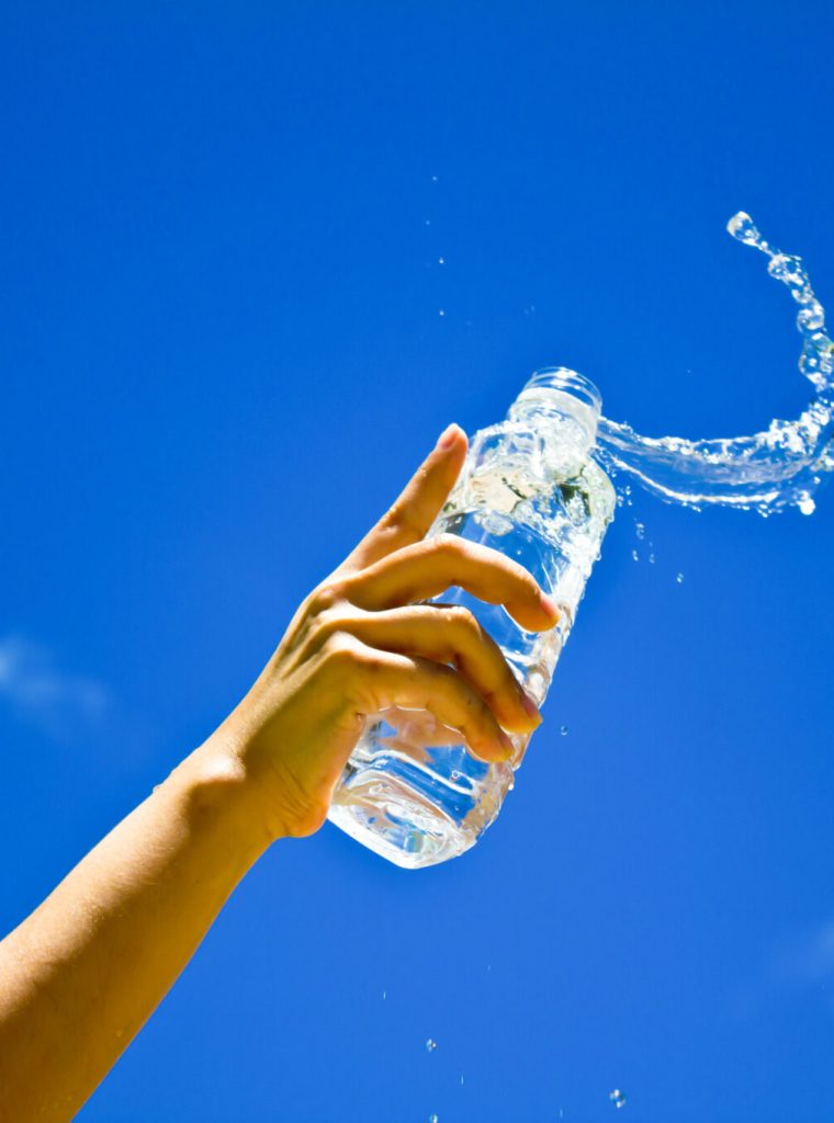 Human hand holding a bottle of water Human hand holding a bottle of water